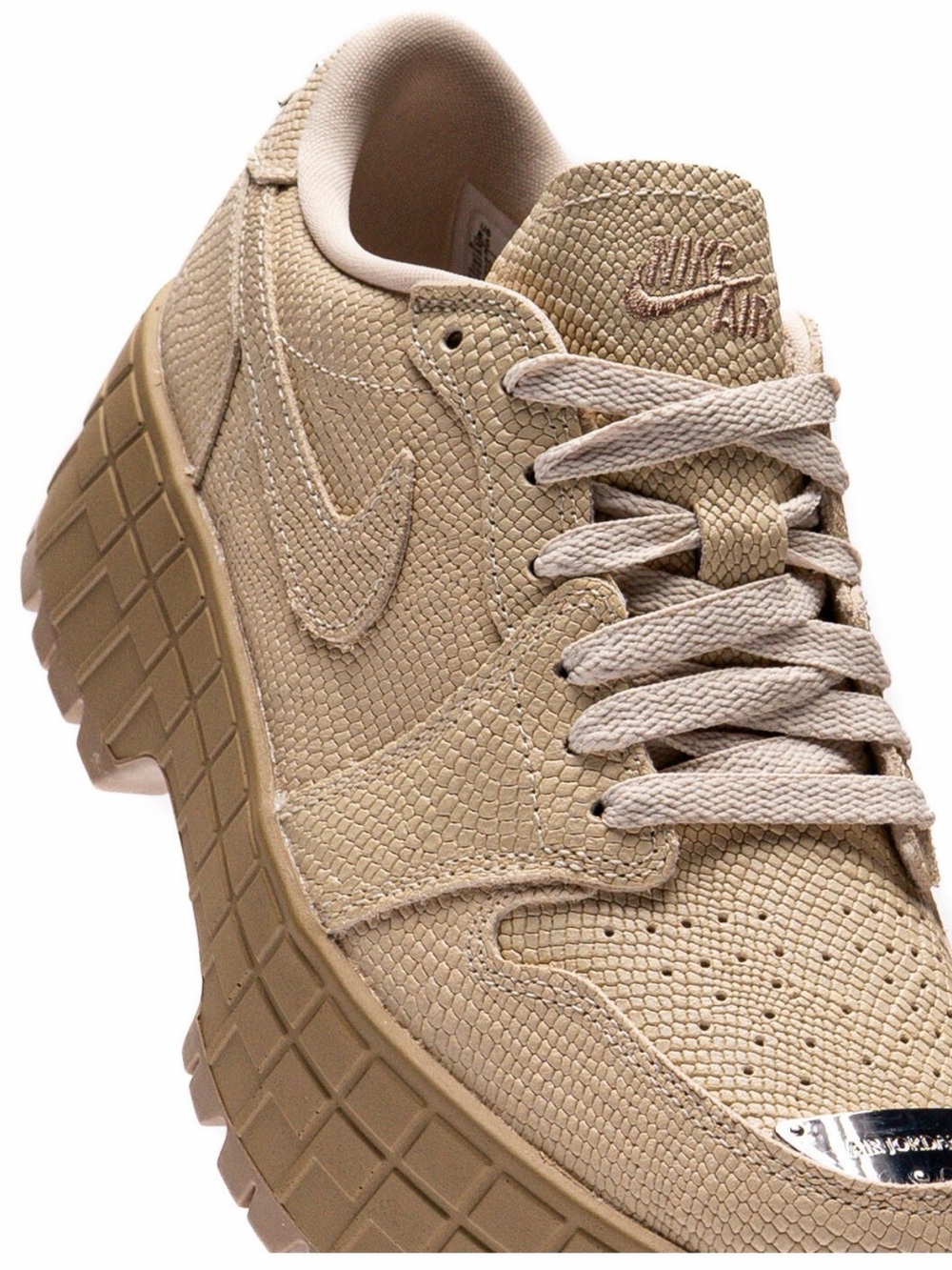 Nike Women’s Beige/Textured Platform Sneaker